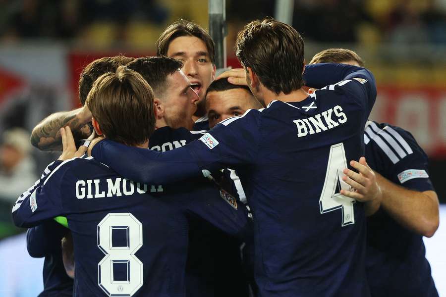 Scotland's John McGinn celebrates scoring their second goal with teammates
