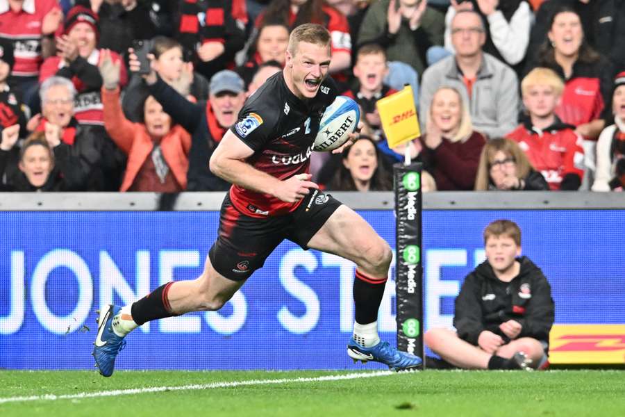 An elated Johnny McNicholl crosses the line against the Blues. 