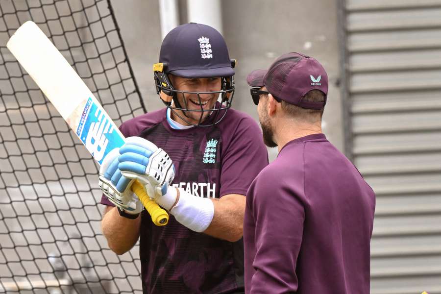 Joe Root and Brendon McCullum share a laugh at training prior to the fourth Test in Melbourne.