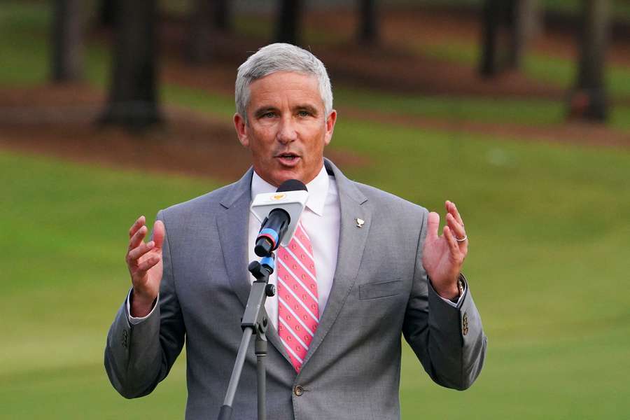 PGA Tour commissioner Jay Monahan talks during the singles match play of the Presidents Cup golf tournament.