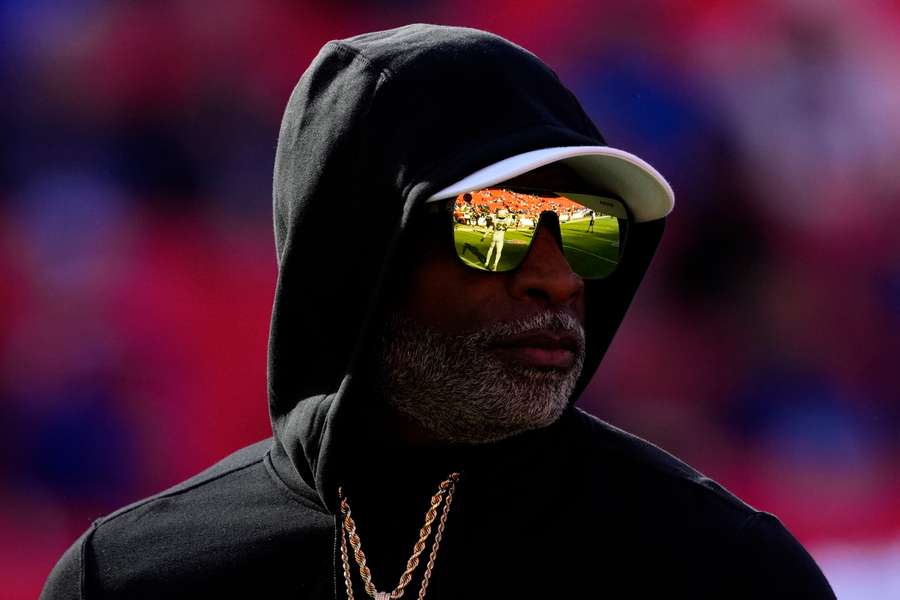 Colorado head coach Deion Sanders looking at the field ahead of a game (2024)