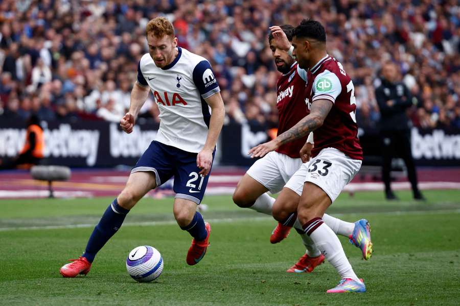 West Ham's Lucas Paqueta (C) and Emerson (R) vie with Tottenham Hotspur's Dejan Kulusevski
