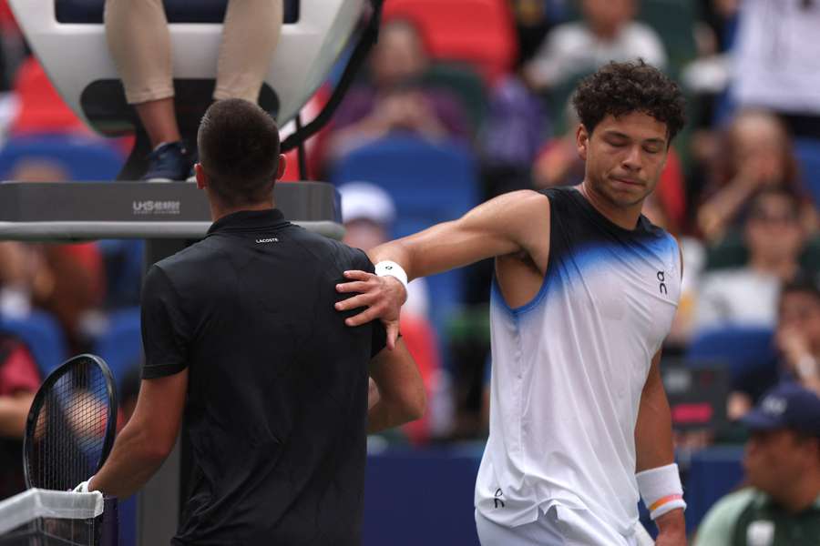 Ben Shelton (right) reacts after losing his third-round match against Arthur Gea