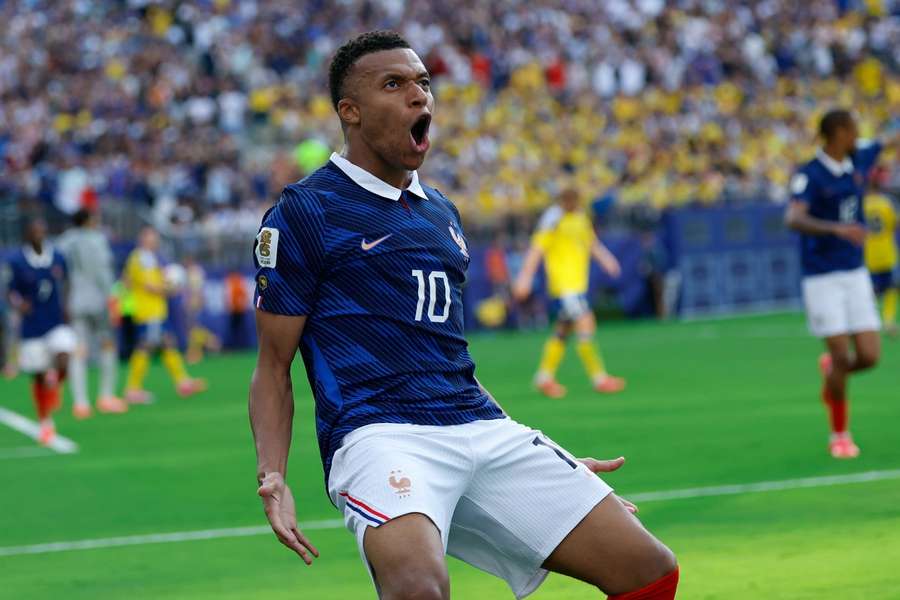 Kylian Mbappe celebrates scoring against Sweden Kylian Mbappe celebrates scoring against Sweden