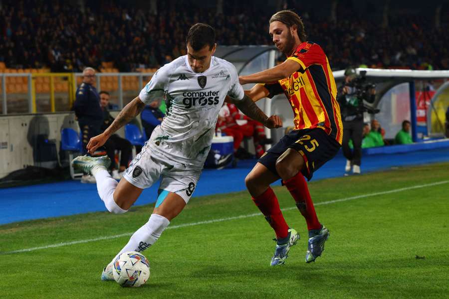 Antonino Gallo of Lecce competes for the ball with Pietro Pellegri of Empoli 