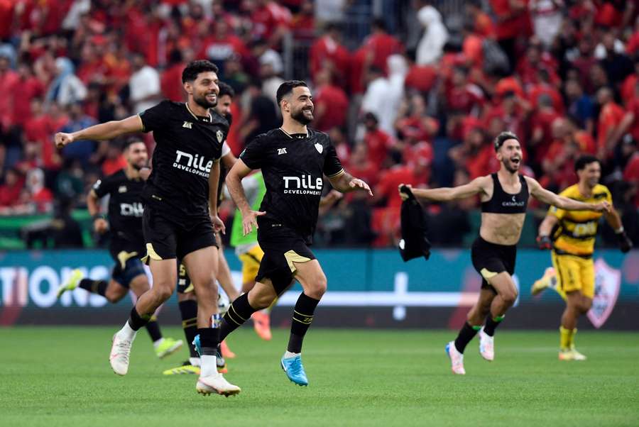 Zamalek players celebrate after winning the penalty shootout