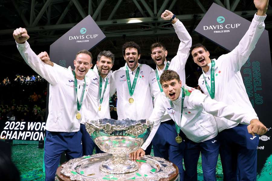 Players of Italy celebrate with the trophy after winning against Spain the Final of the Davis Cup 2025