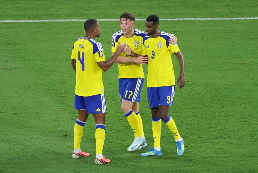 Isak (right) celebrates his goal