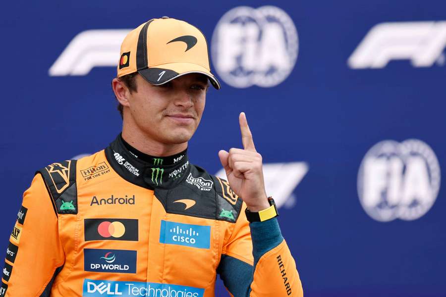 Lando Norris celebrates after qualifying in pole position