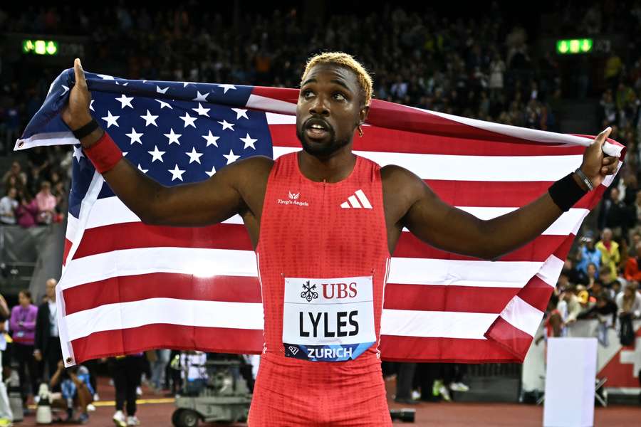 Noah Lyles celebrates after winning the 200m at the final Diamond League meet of the season on Thursday