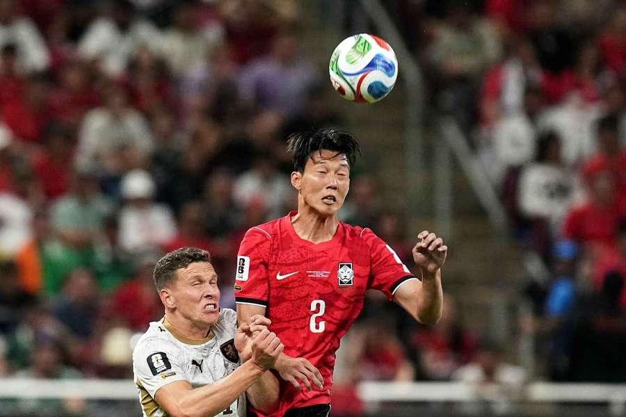 Czechia's Lukas Provod, left, battles against South Korea's Lee Han-beom during the World Cup clash