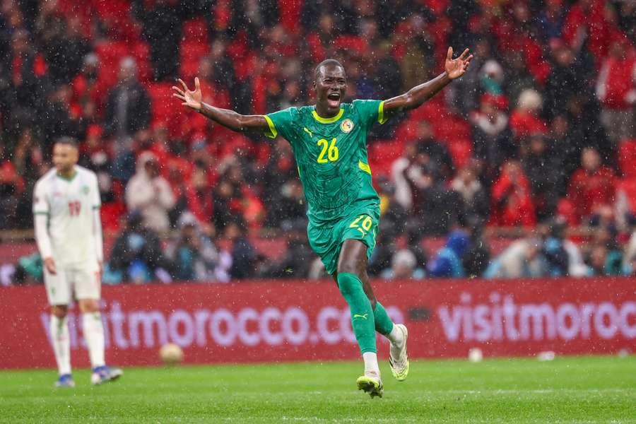 Senegal's Pape Gueye celebrates their victory in the final