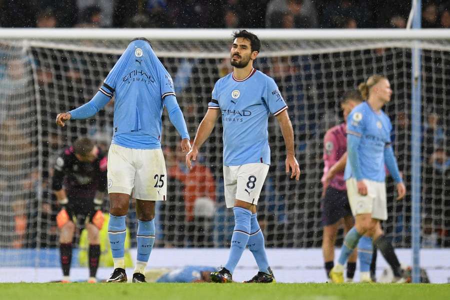 Man City players react after the final whistle against Everton 