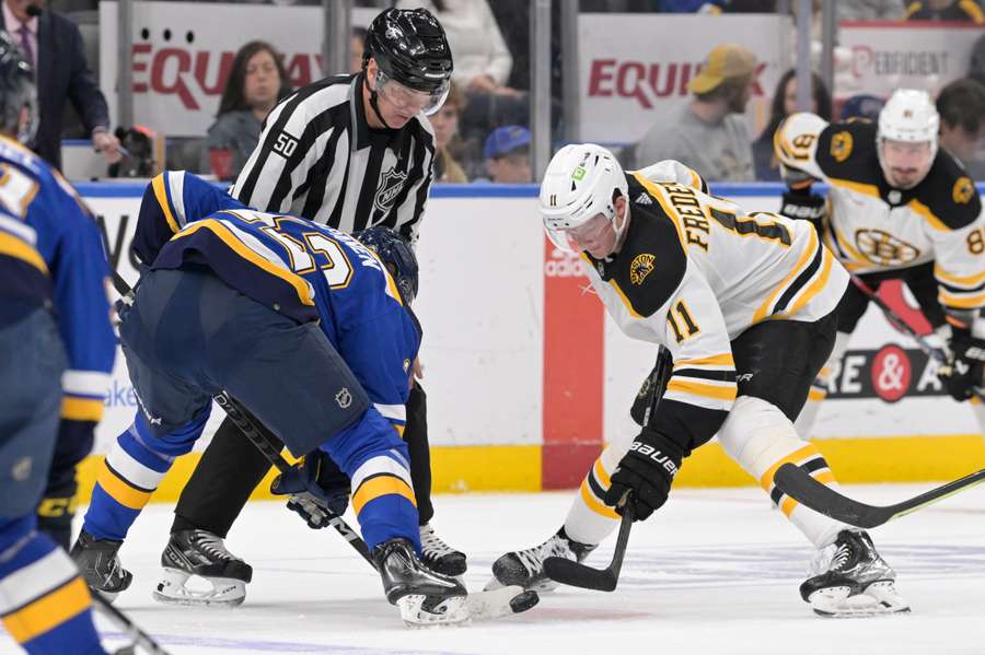 Bruins top Blues, reach historic 60-win mark