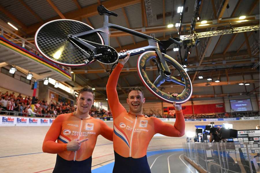 Silver medallist Jeffrey Hoogland (left) and gold medallist Harrie Lavreysen celebrate after the men's sprint