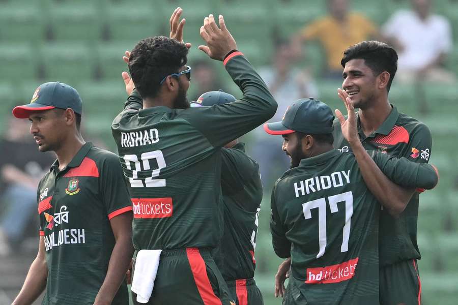 Nahid Rana celebrates one of his five wickets with teammates on Wednesday.