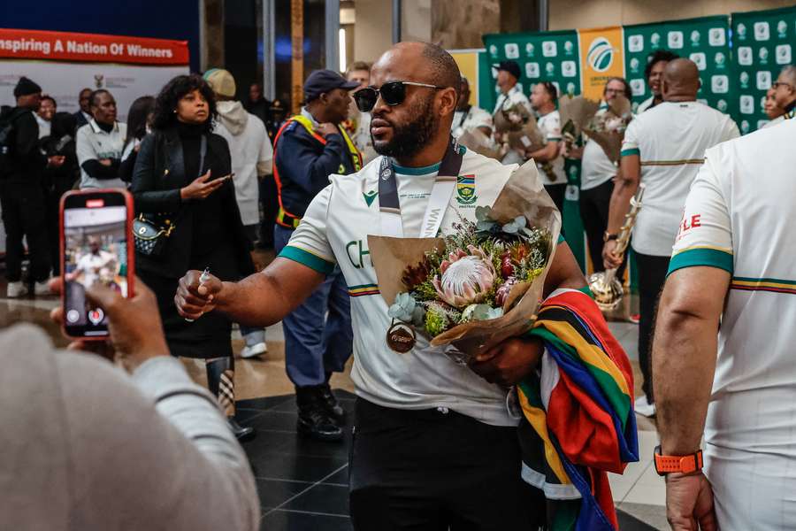 Temba Bavuma pictured arriving to a hero's welcome at O.R. Tambo International Airport