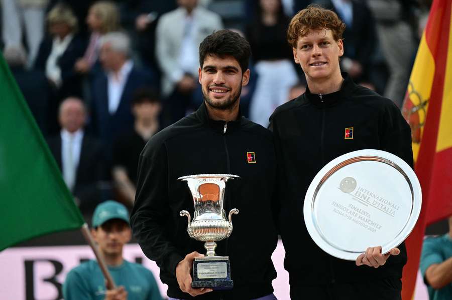 Alcaraz (L) poses with Sinner after winning the Italian Open
