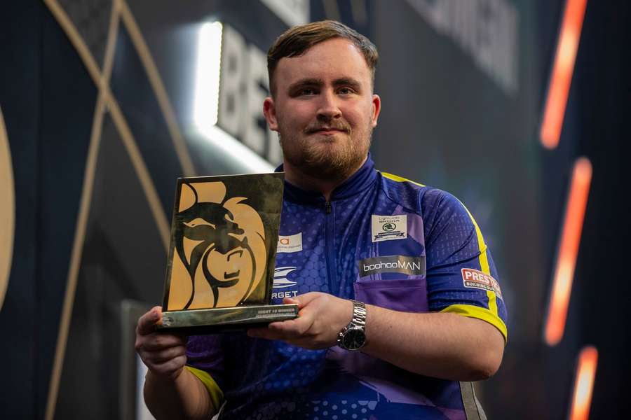 Littler with his prize for victory in Manchester