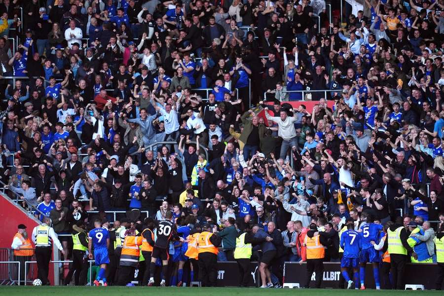 Leicester's players celebrate in front of their fans