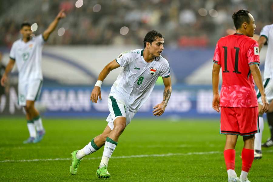 Iraq's Ibrahim Bayesh Al-Kaabawi celebrates after scoring a goal against South Korea in 2024.