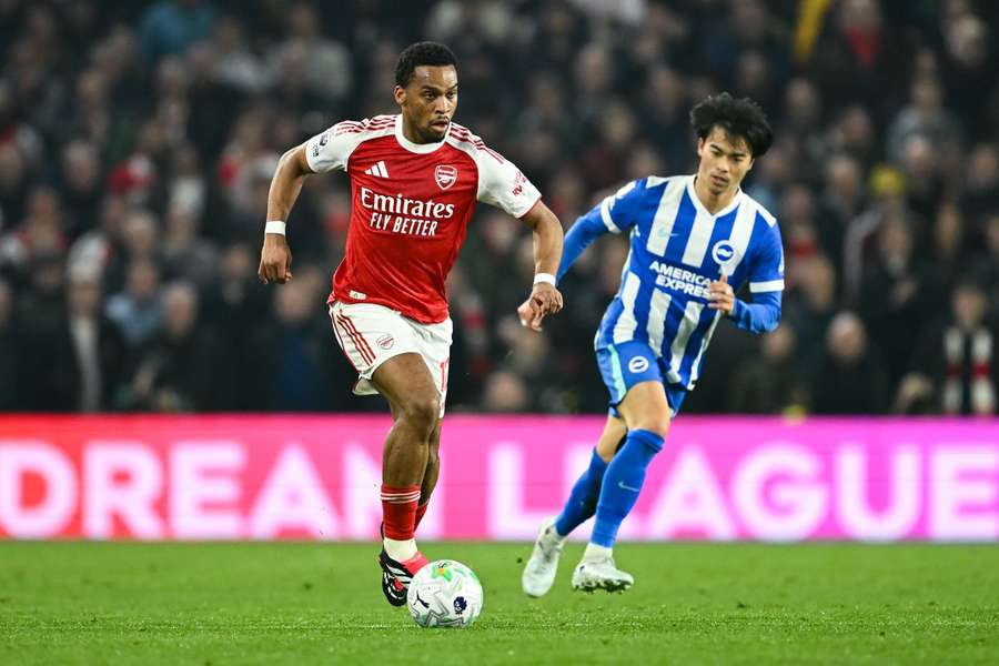 Arsenal's Jurrien Timber holds off the challenge from Brighton's Kaoru Mitoma Arsenal's Jurrien Timber holds off the challenge from Brighton's Kaoru Mitoma