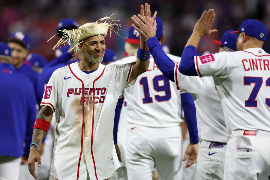 Puerto Rico's Eddie Rosario celebrates with teammates after win over Cuba at 2026 World Baseball Classic