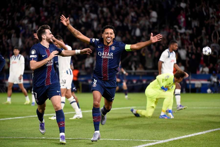 Marquinhos and Kvaratskhelia celebrate the opener