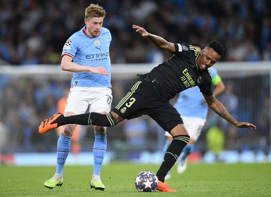Kevin De Bruyne vies with Eder Militao Kevin De Bruyne vies with Eder Militao