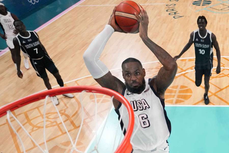 LeBron James dunks a basket for the USA against South Sudan