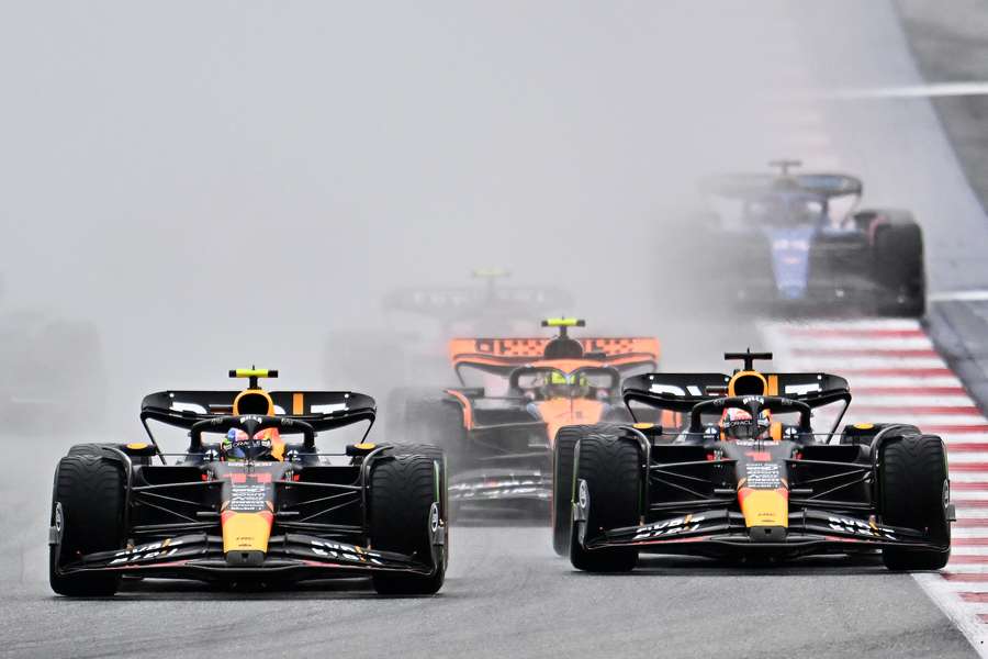 Red Bull's Sergio Perez (L) and Max Verstappen take the lead at the start of the sprint