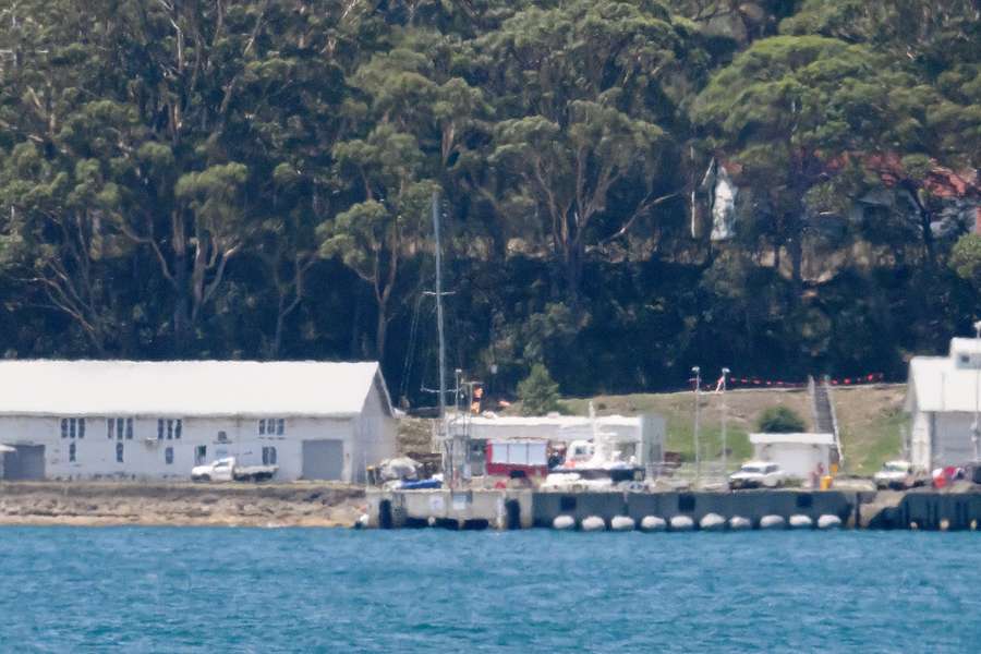 The mast of Flying Fish Arctos is seen from behind a wall at the Royal Australian Yachts club in Jervis Bay