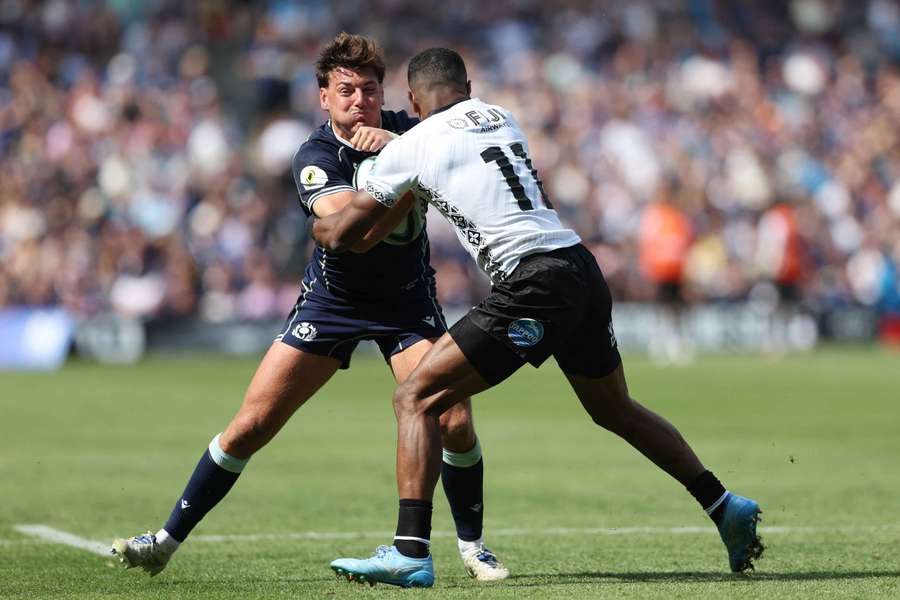 Scotland's Tom Jordan in action with Fiji's Jiuta Wainiqolo Scotland's Tom Jordan in action with Fiji's Jiuta Wainiqolo