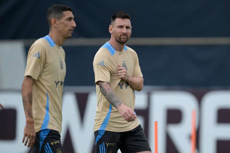 Argentina's forward #10 Lionel Messi (R) and forward #11 Angel Di Maria take part in a training session