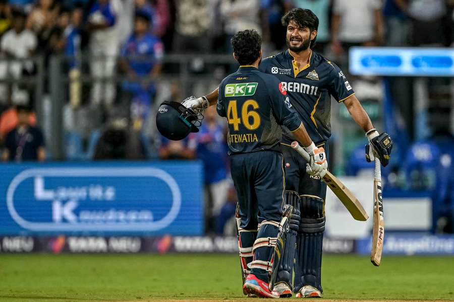 Arshad Khan (right) and Rahul Tewatia celebrate their team's win at the end of the IPL match between Mumbai Indians and Gujarat Titans