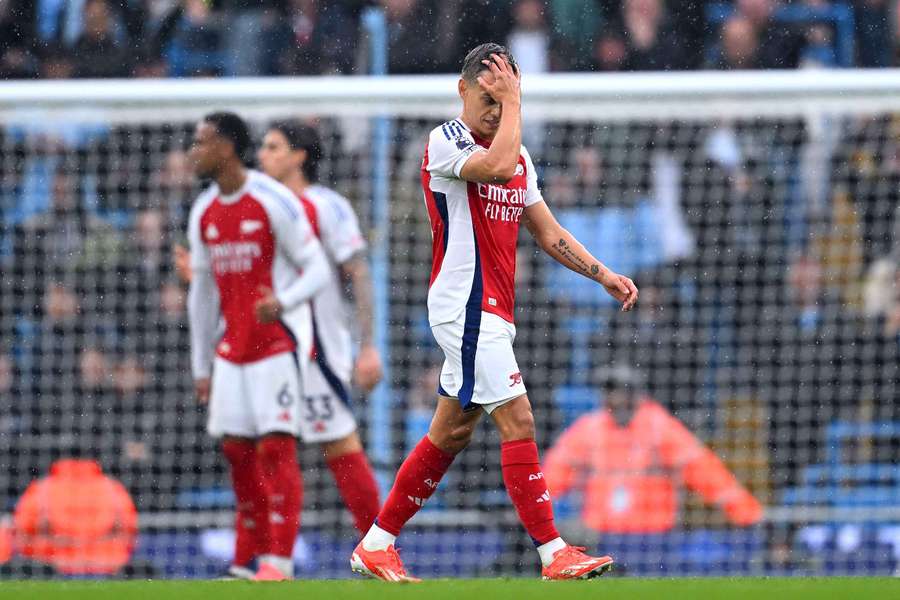 Arsenal's Leandro Trossard leaves the pitch after being shown a red card against Manchester City