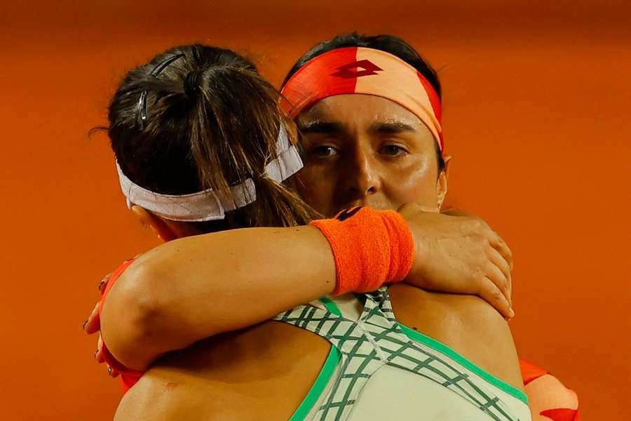 Ons Jabeur embraces Olga Danilovic after their encounter on Saturday night