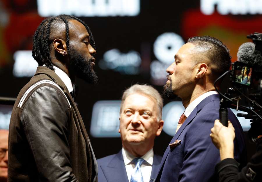 Deontay Wilder with Joseph Parker as Promotor Frank Warren looks on during the press conference