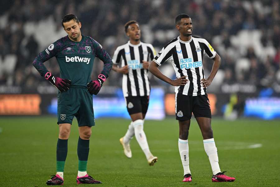 Alexander Isak celebrates giving Newcastle a 4-1 lead, as Lukasz Fabianski looks on