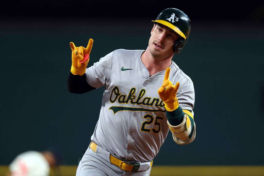 Athletics' Brent Rooker rounding the bases after a home run against the Texas Rangers