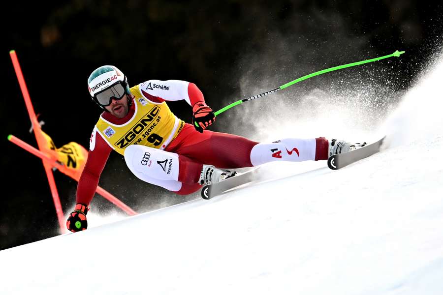 Vincent Kriechmayr competes in the men's downhill event during the Alpine Ski World Cup in Bormio, northern Italy