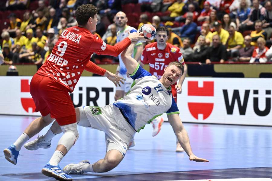 Croatia's Luka Lovre Klarica (left) and Slovenia's Kristjan Horzen in action in a situation that leads to a penalty 