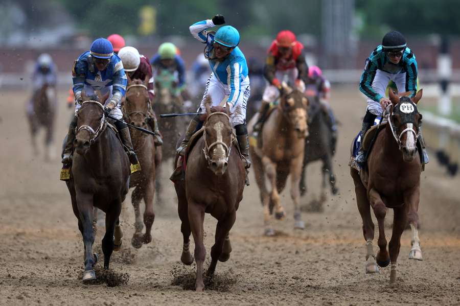 Jockey Javier Castellano celebrates atop Mage after winning the 149th running of the Kentucky Derby