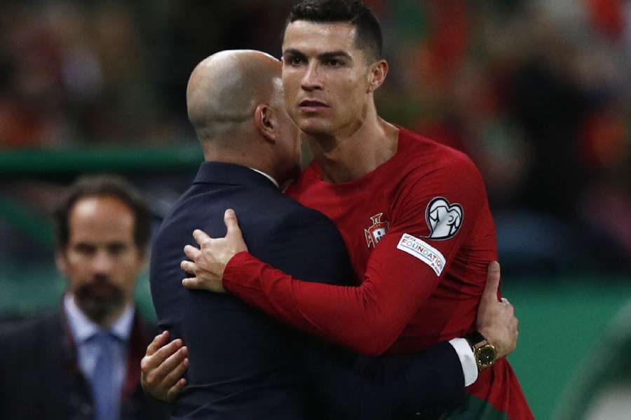 Roberto Martinez and Cristiano Ronaldo embrace