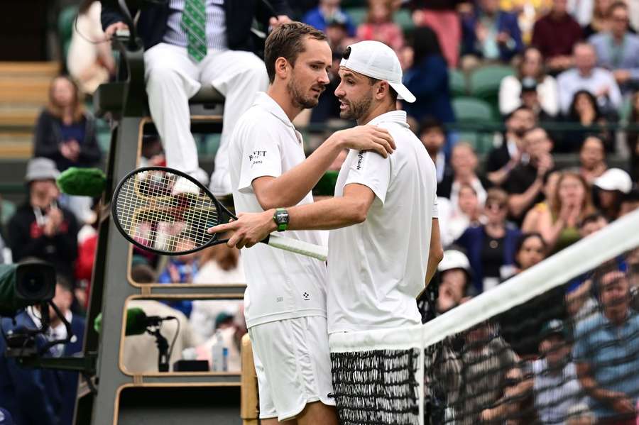 Grigor Dimitrov (r) picked up the injury early in the match
