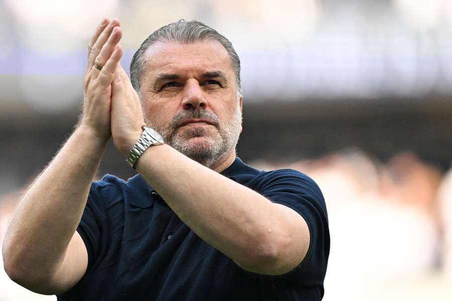 Tottenham Hotspur's Greek-Australian Head Coach Ange Postecoglou applauds during a lap of appreciation 