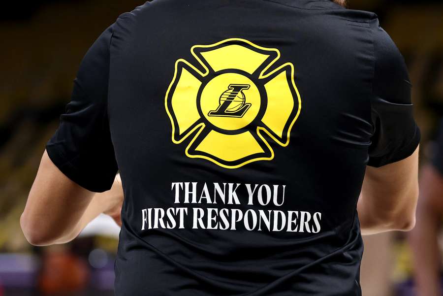 A member of the Los Angeles Lakers wears a shirt thanking first responders battling the wildfires prior to a game against the San Antonio Spurs