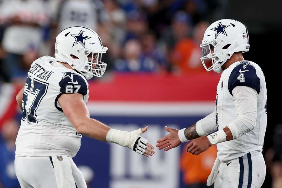 Dak Prescott of the Dallas Cowboys celebrates a touchdown with Brock Hoffman