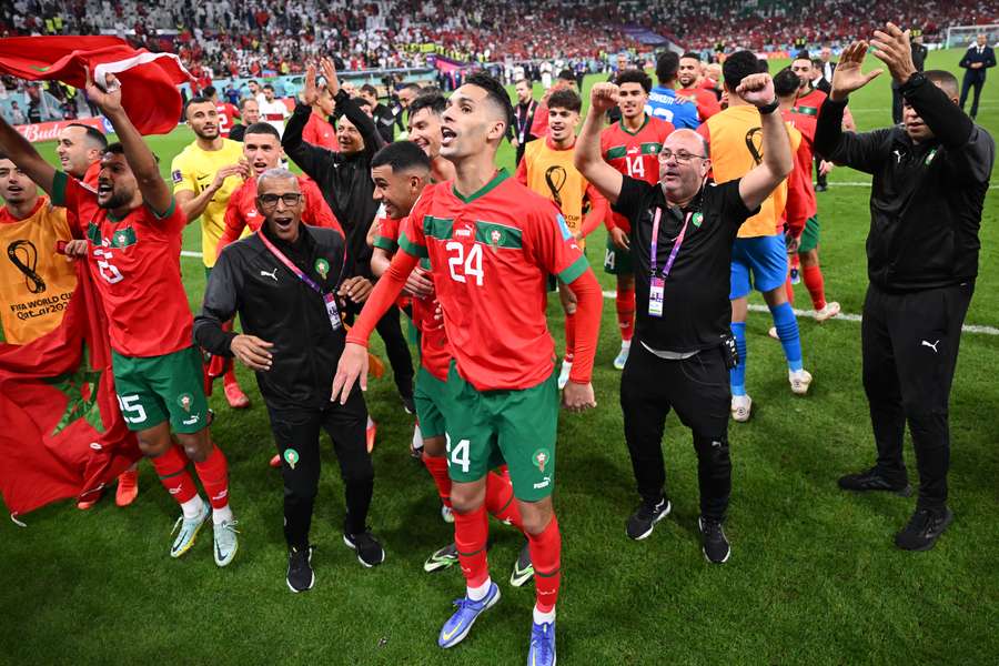 Morocco players celebrated with fans after knocking out Portugal