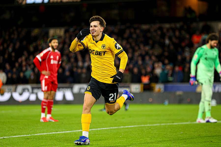 Wolves' Rodrigo Gomes celebrates scoring against Liverpool